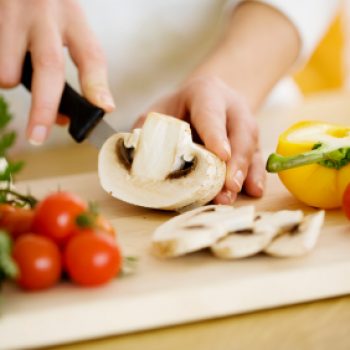 female chopping food ingredients
